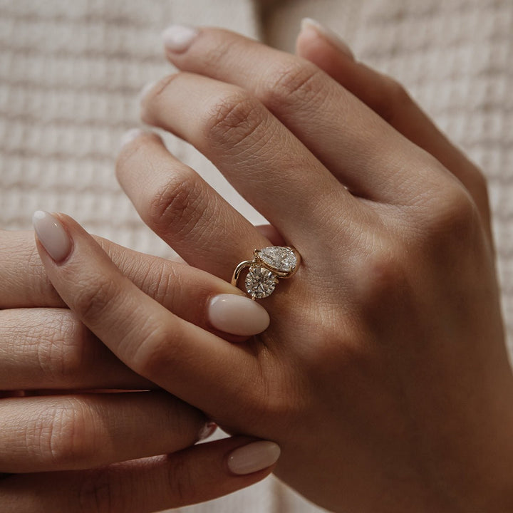 Round cut solitaire engagement ring shown in real-life wear