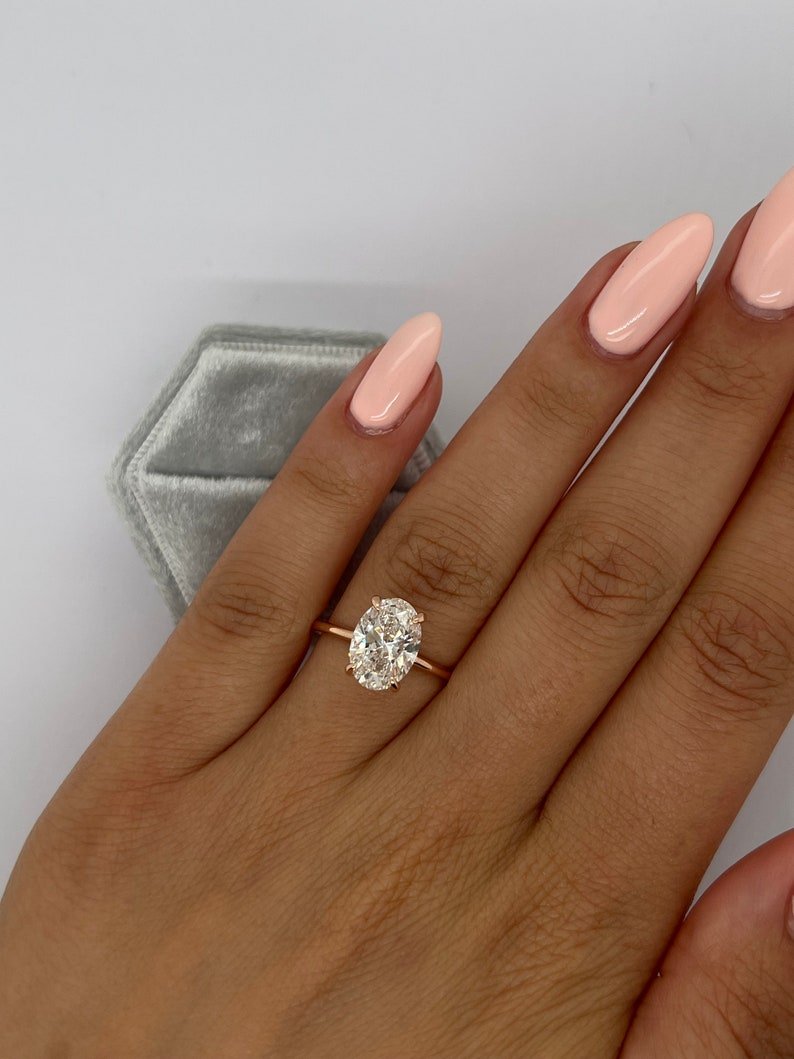 Classic oval hidden halo engagement ring crafted for everyday wear
