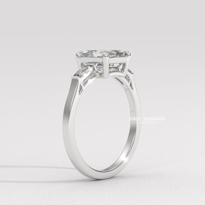 Side angle of asscher three stone diamond engagement ring