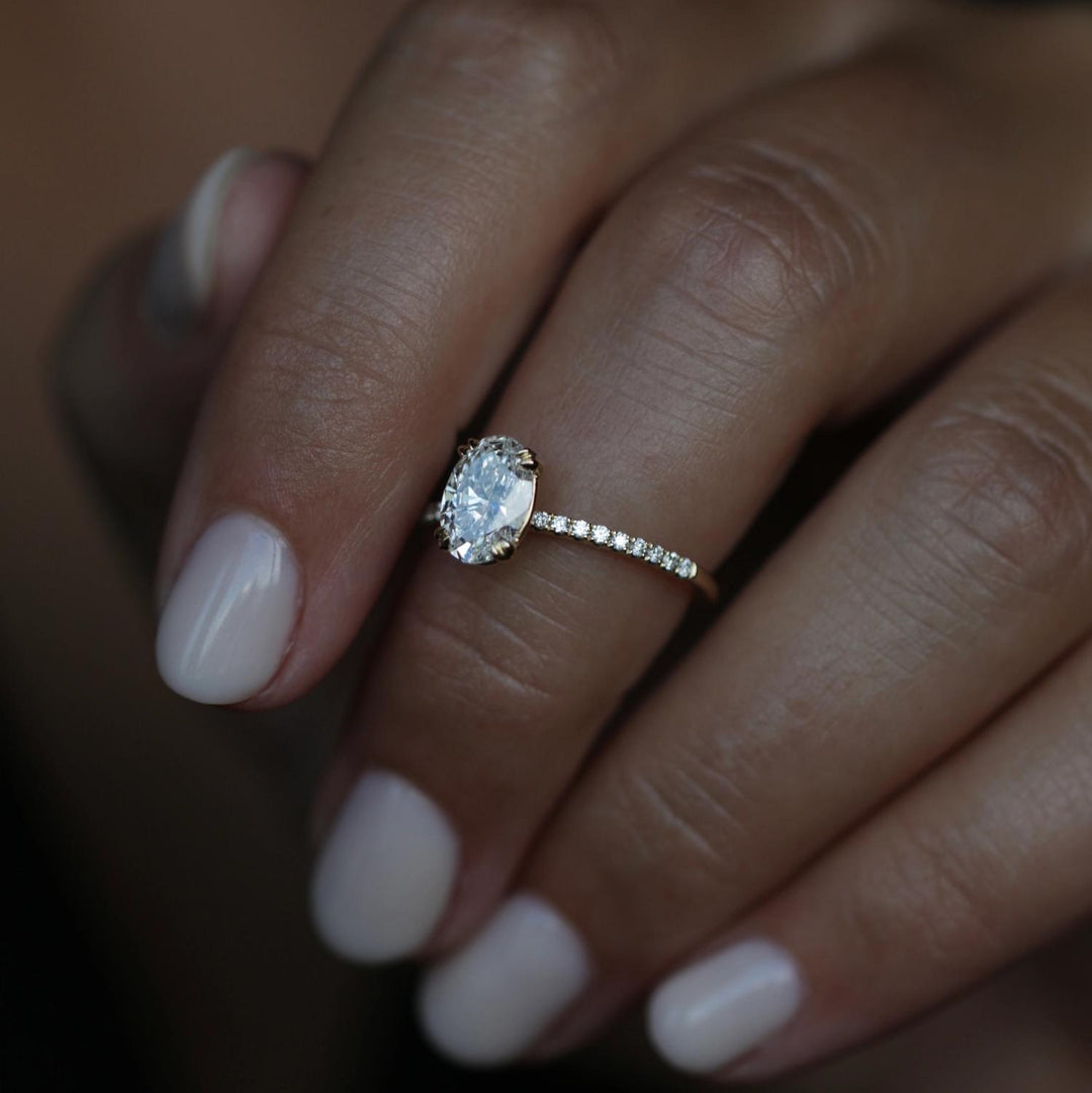 Oval solitaire lab grown diamond ring fitted on finger