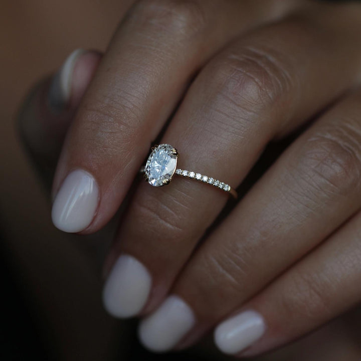 Oval solitaire lab grown diamond ring fitted on finger