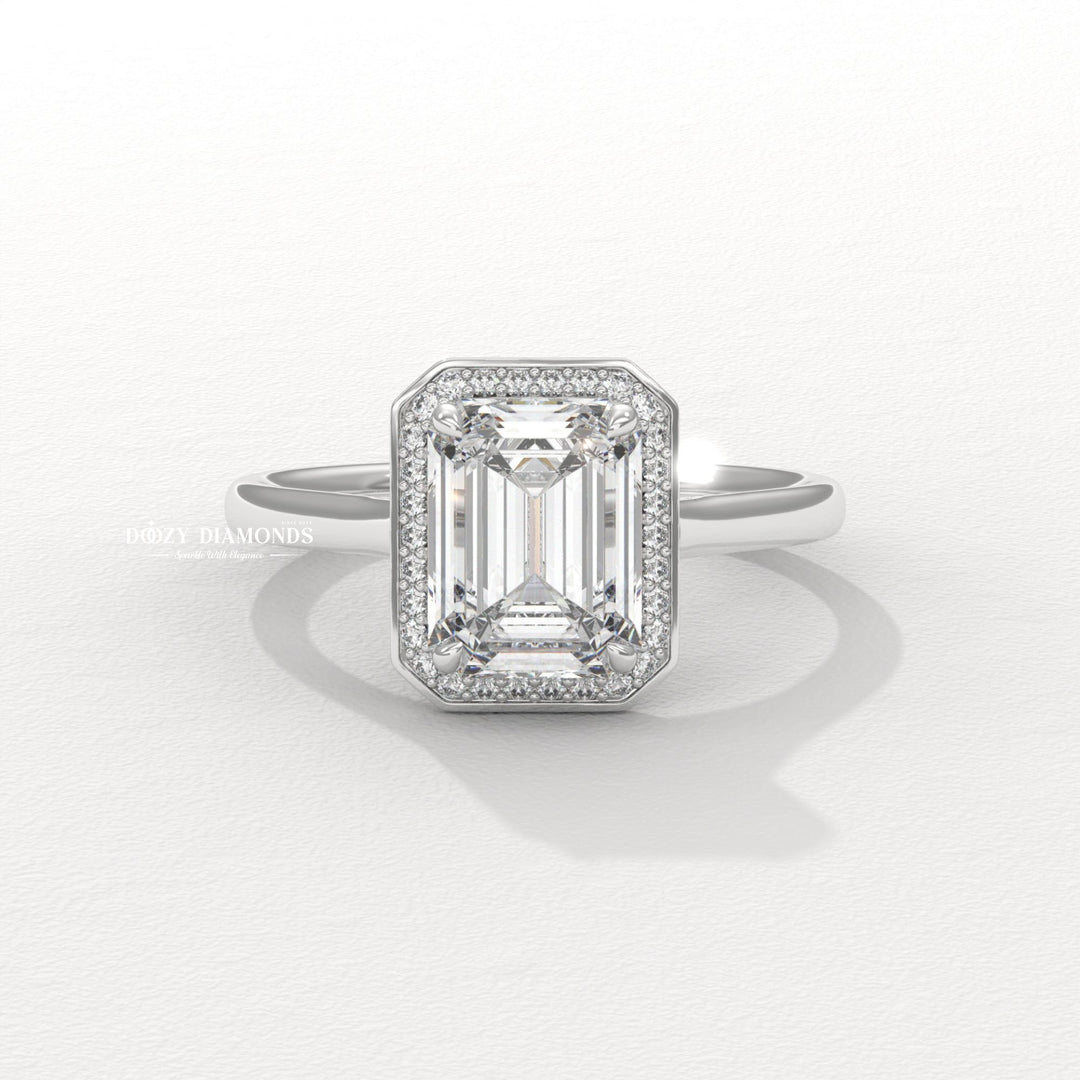 Emerald halo engagement ring with IGI certificate and packaging