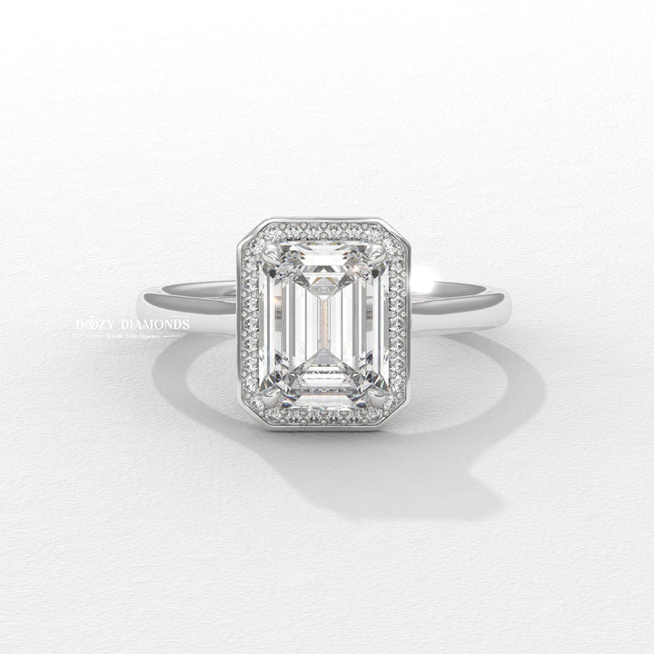 Emerald halo engagement ring with IGI certificate and packaging
