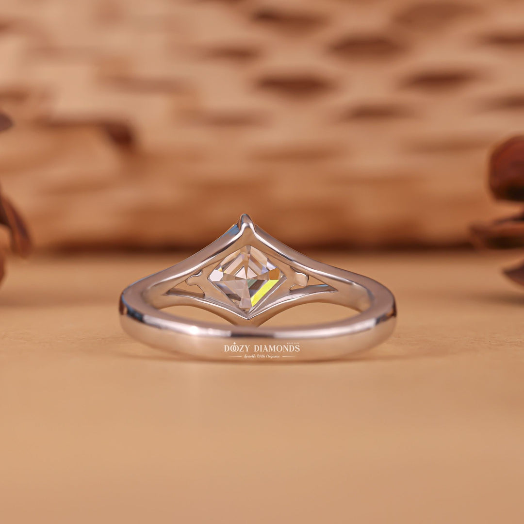 Macro shot of asscher cut diamond facets in split shank ring setting