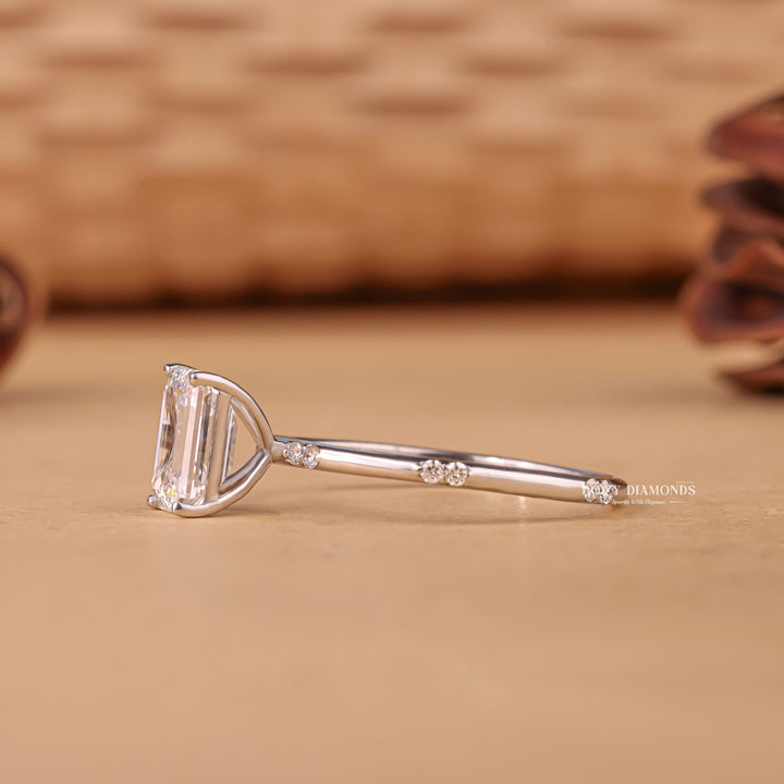 Emerald pave engagement ring viewed from the side