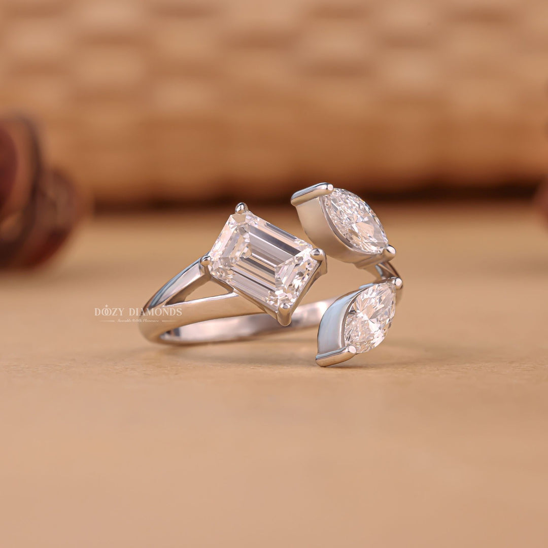 Close-up of marquise cut center diamond in three stone engagement ring