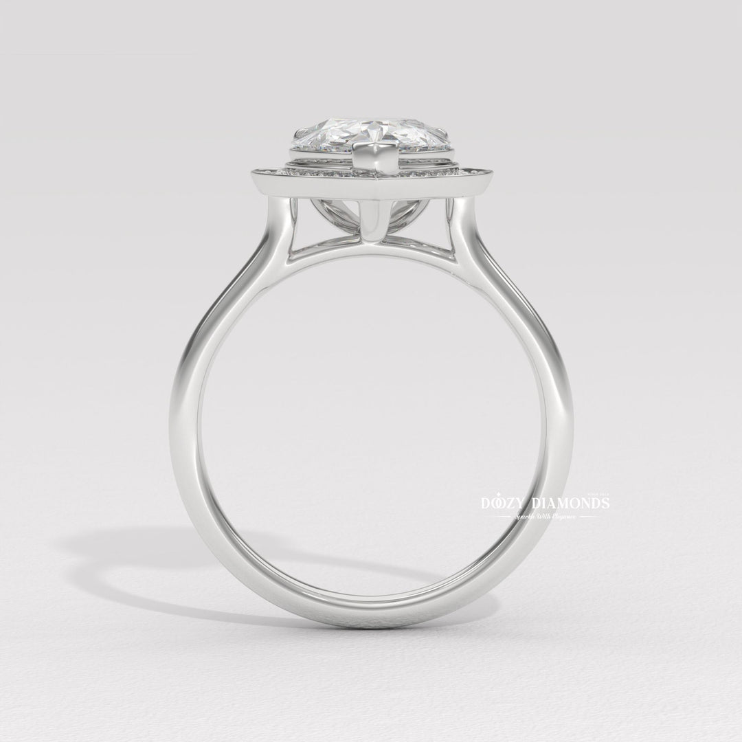 Pear halo engagement ring finished in polished solid gold