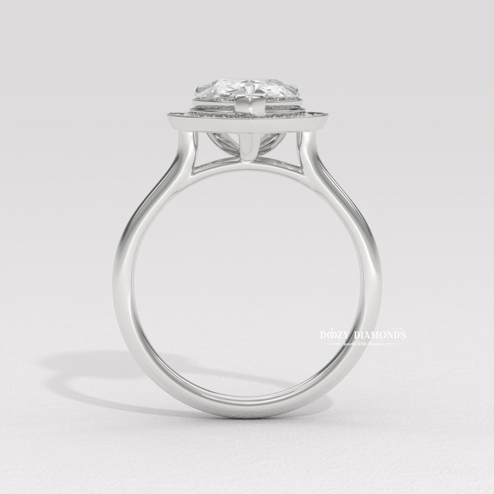 Pear halo engagement ring finished in polished solid gold