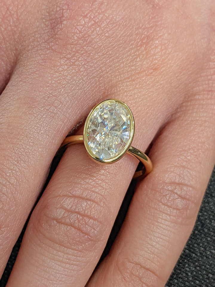Discover oval bezel lab grown diamond engagement ring online