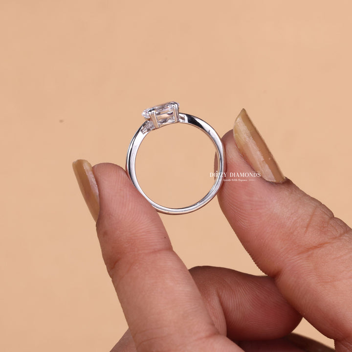 Oval cut diamond ring worn on hand