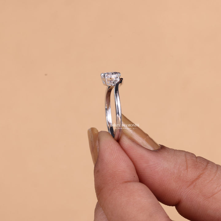 Oval solitaire lab grown diamond ring fitted on finger