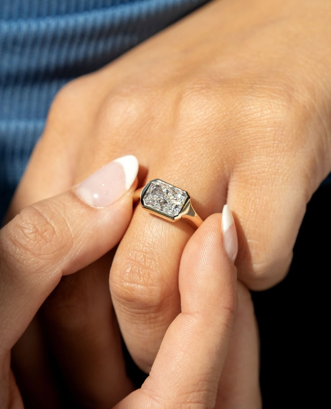 Side angle of radiant bezel diamond engagement ring