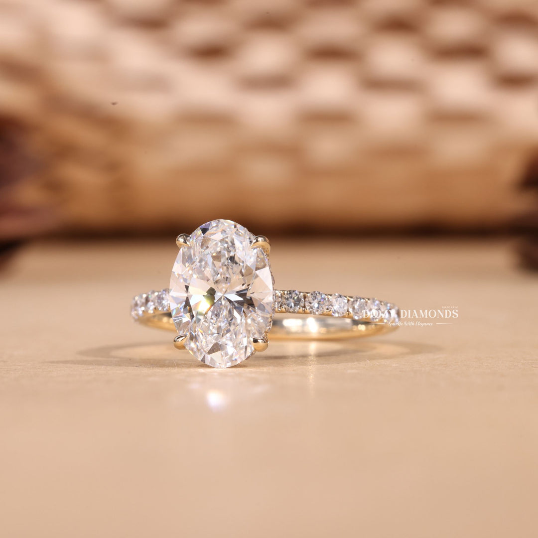 Lifestyle shot of oval hidden halo diamond ring on hand