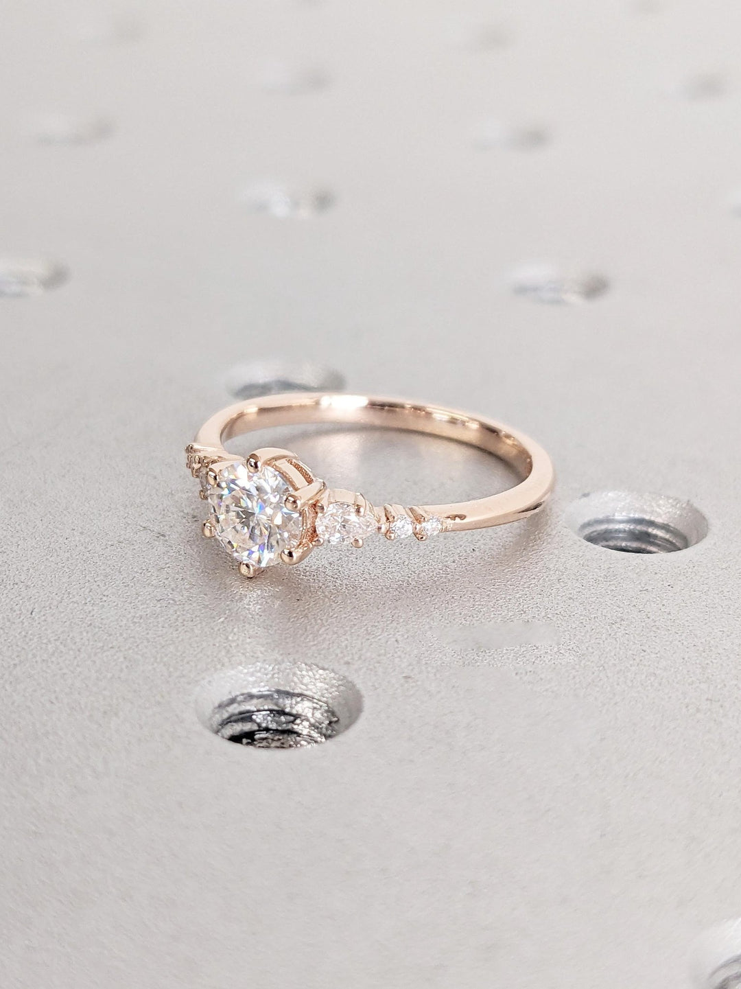 Top-down view of round cut cluster engagement ring