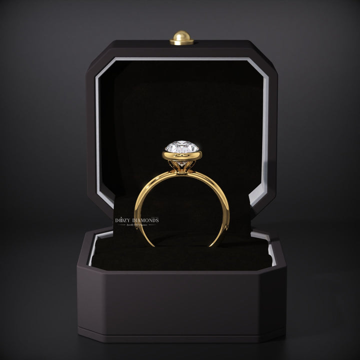Lifestyle shot of oval bezel diamond ring on hand