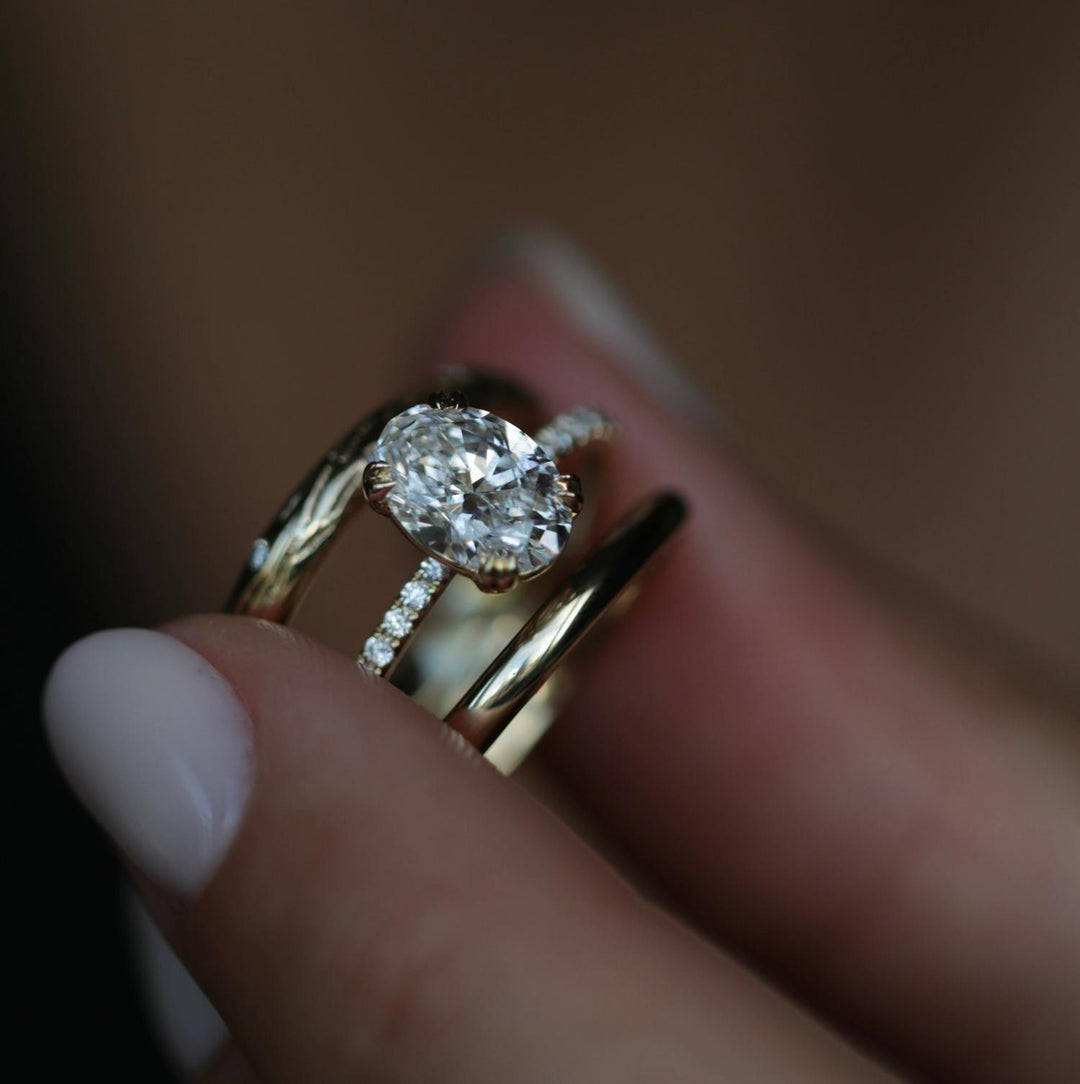 Oval solitaire diamond engagement ring available in multiple metals