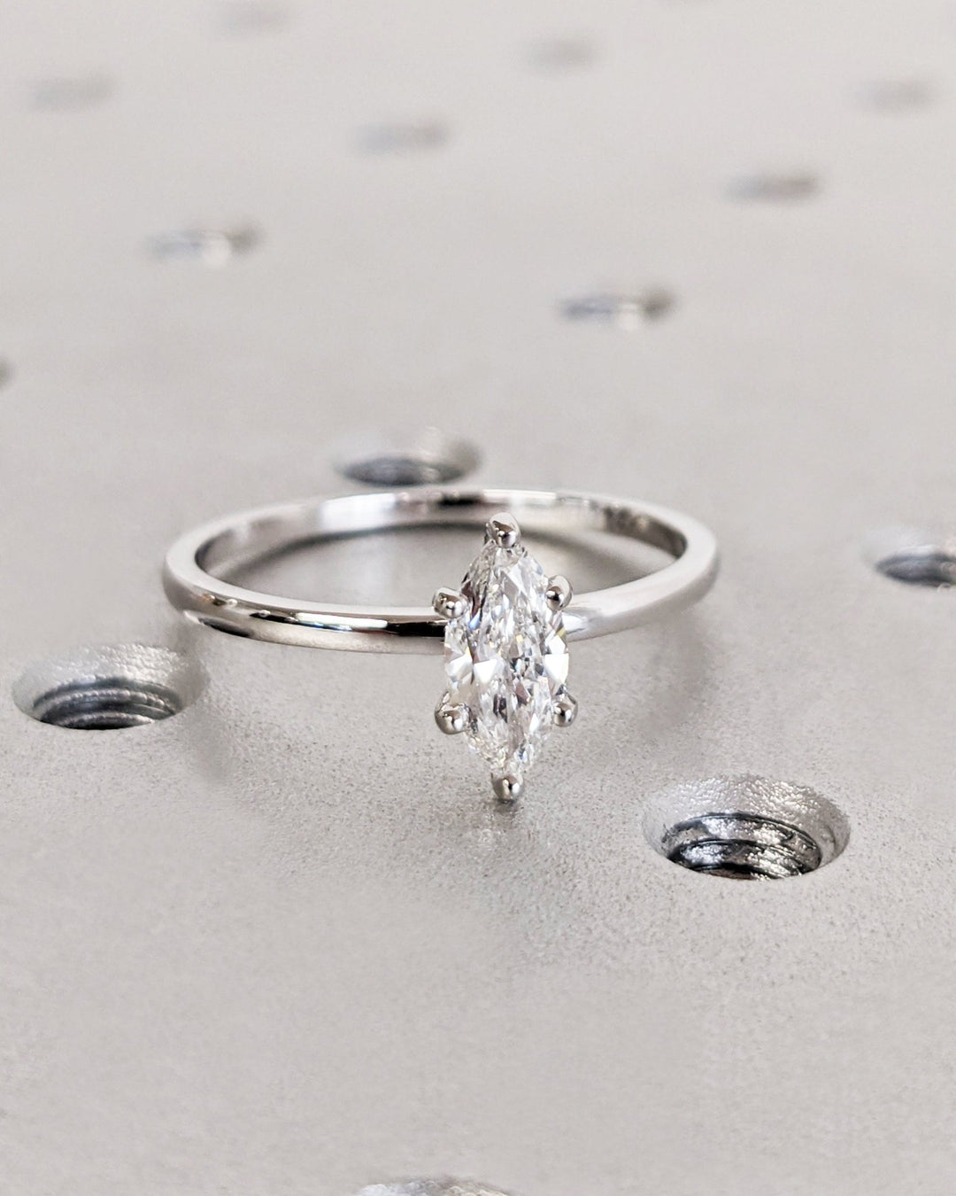 Marquise solitaire engagement ring viewed from the side
