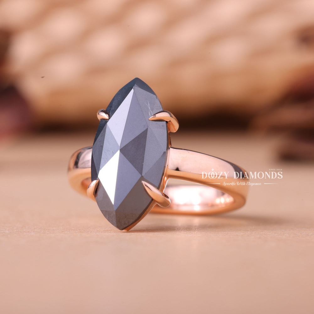 Close-up of marquise cut center diamond in solitaire engagement ring