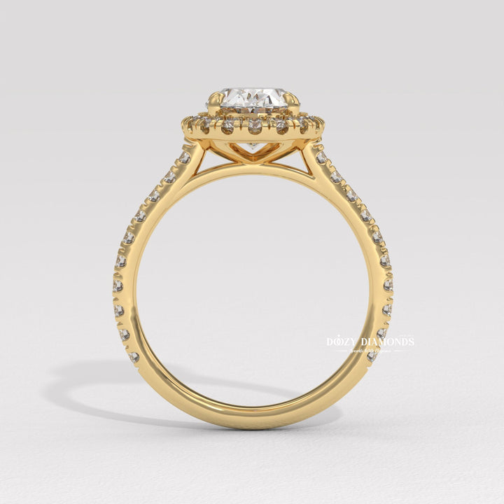Oval halo engagement ring viewed from the side