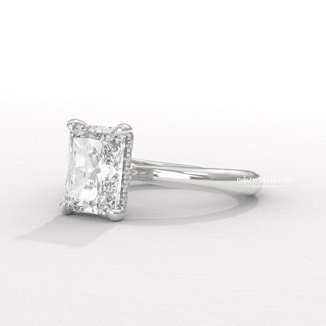 Radiant hidden halo engagement ring viewed from the side