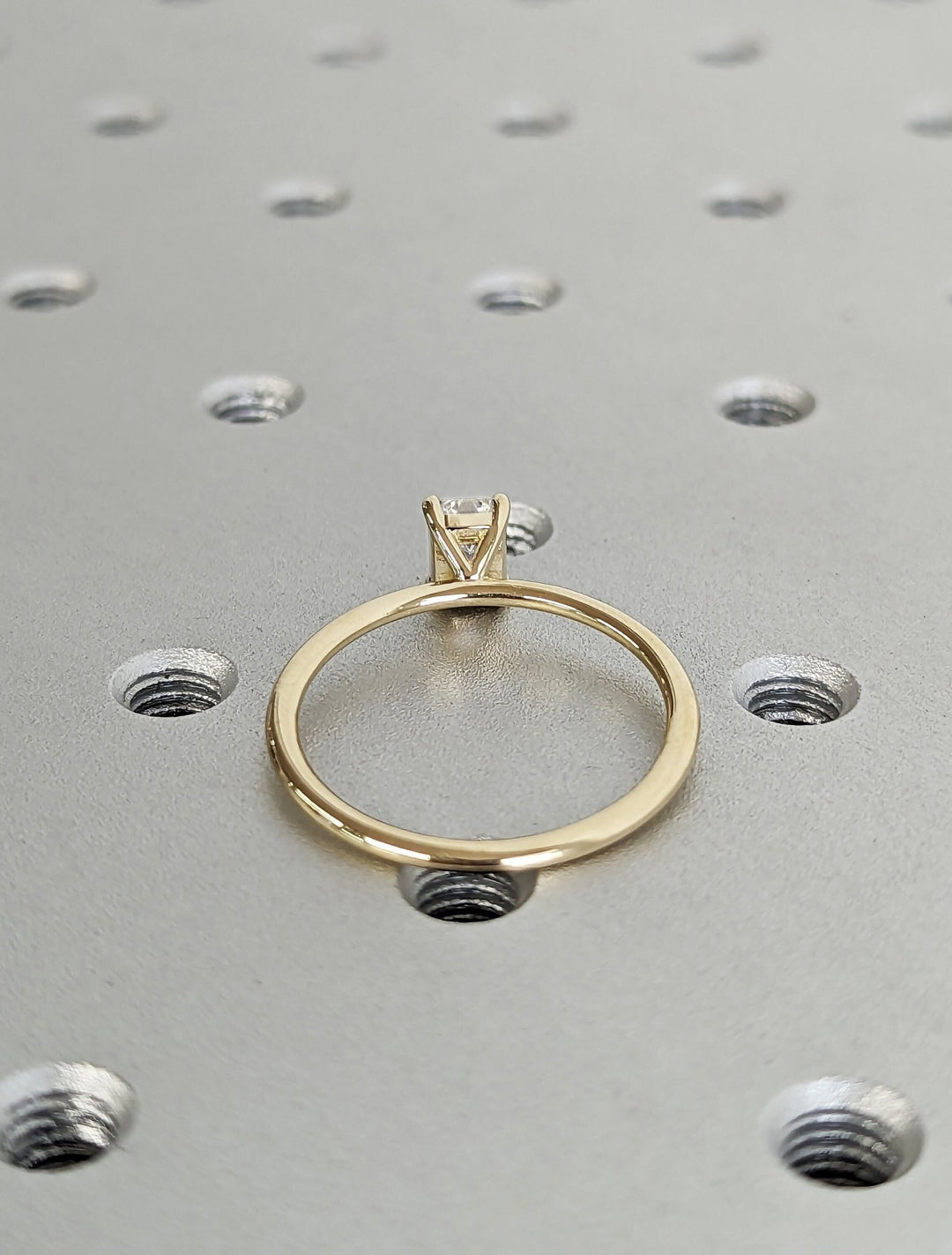 Emerald solitaire lab grown diamond ring side profile in gold setting