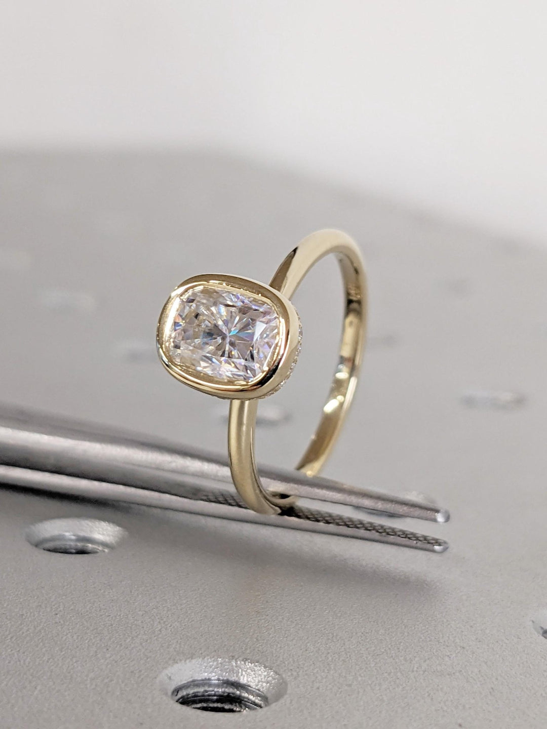 Cushion cut engagement ring side view showing band detail