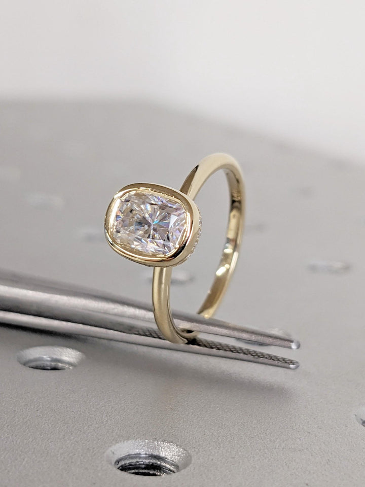 Cushion cut engagement ring side view showing band detail