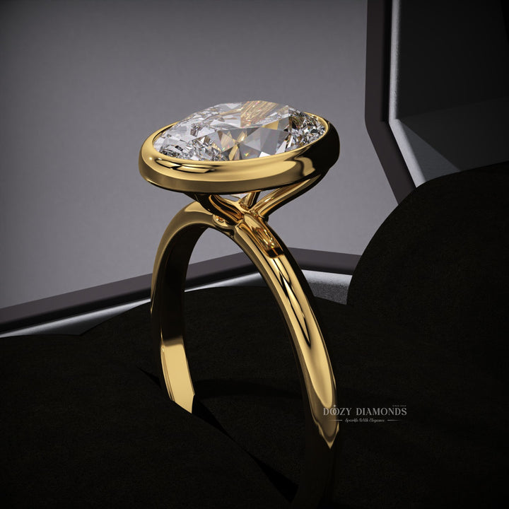 Oval cut bezel engagement ring shown in real-life wear