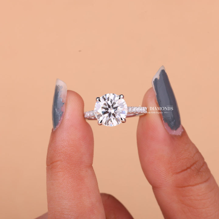 Round cut diamond ring worn on hand