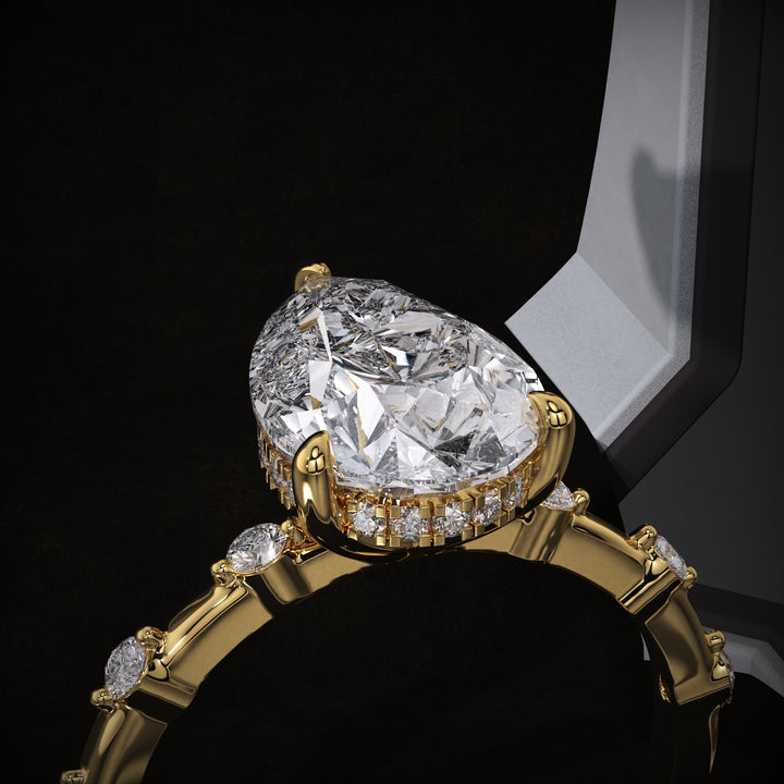 Pear hidden halo engagement ring close-up highlighting diamond sparkle