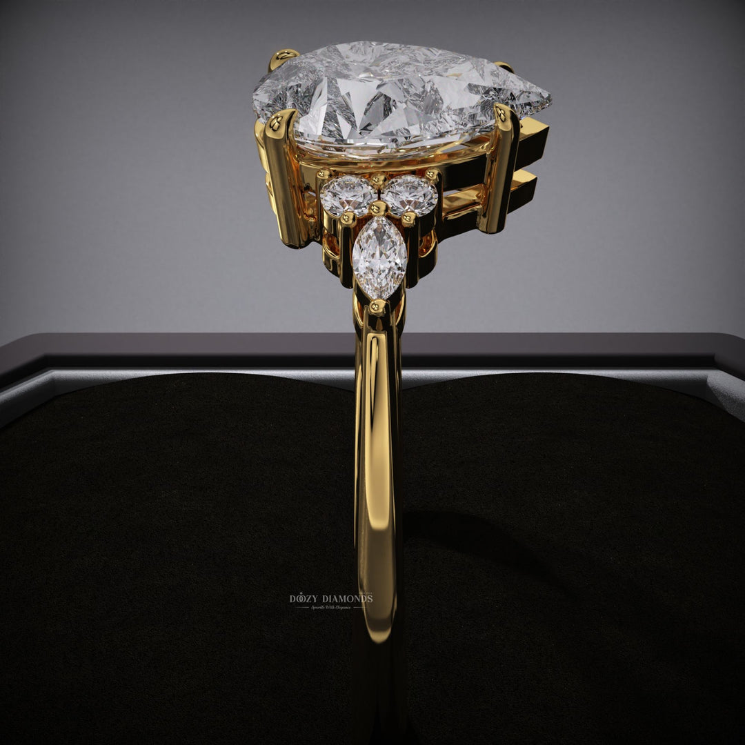 Pear cluster engagement ring offered in gold and platinum