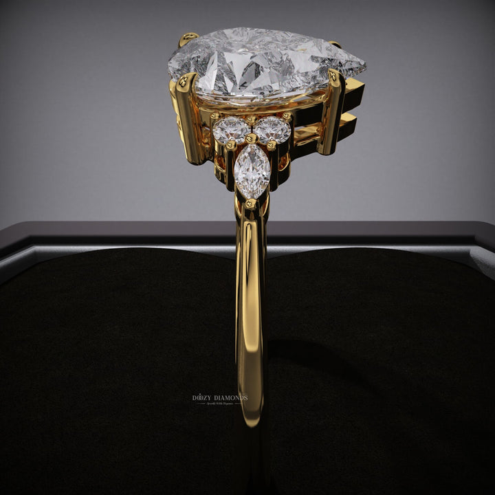 Pear cluster engagement ring offered in gold and platinum