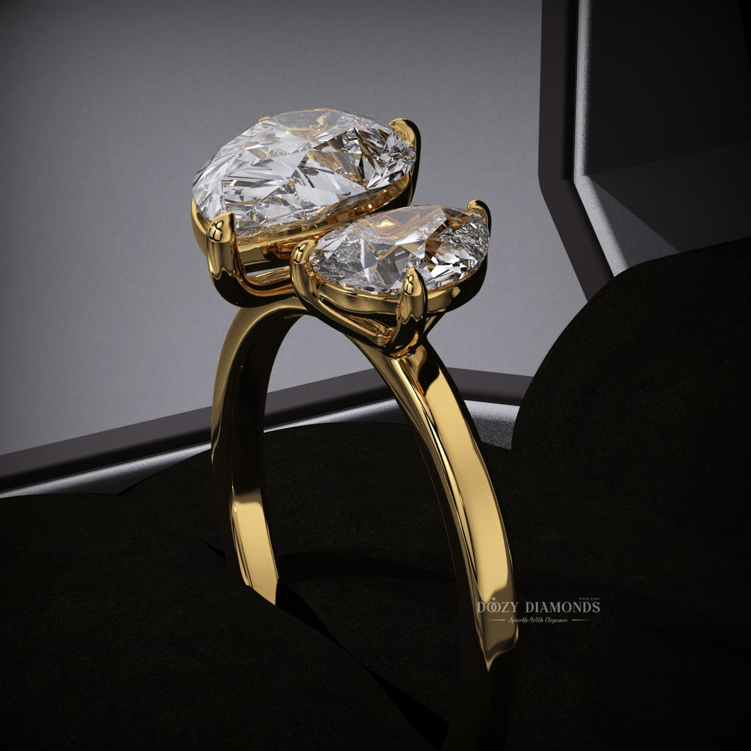 Lifestyle shot of pear solitaire diamond ring on hand