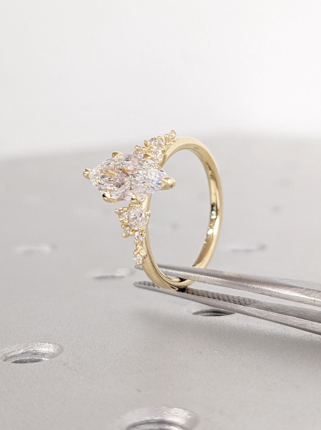 Side angle of marquise cluster diamond engagement ring