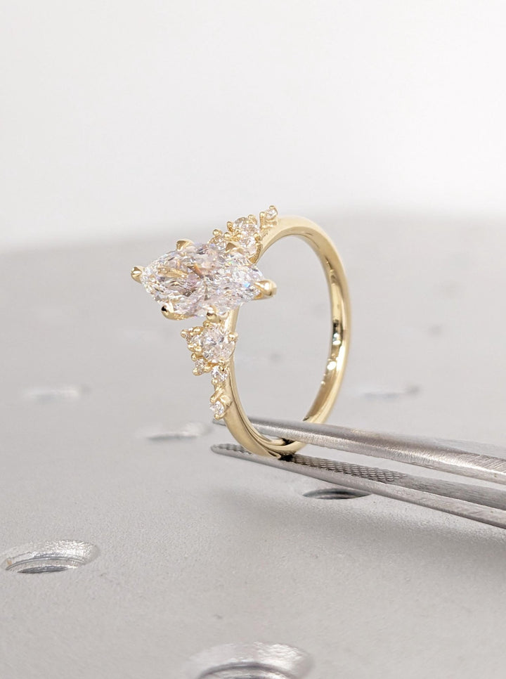 Side angle of marquise cluster diamond engagement ring