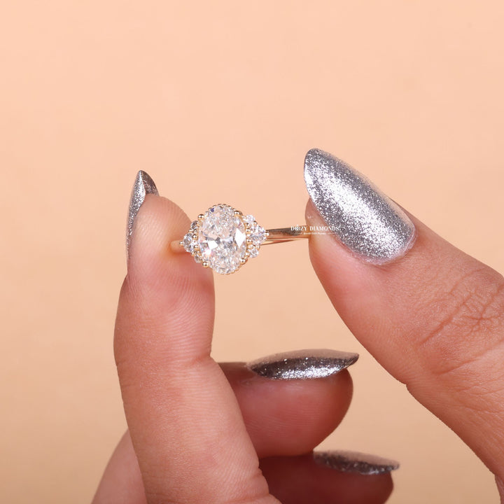 Oval cut diamond ring worn on hand