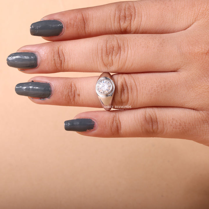 Angled view of round cut diamond in dome setting