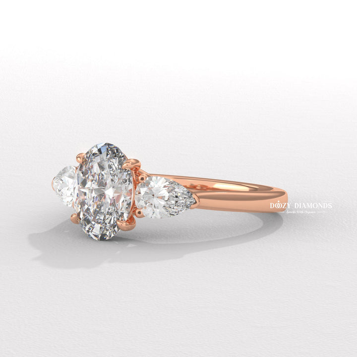 Oval three stone lab grown diamond ring fitted on finger