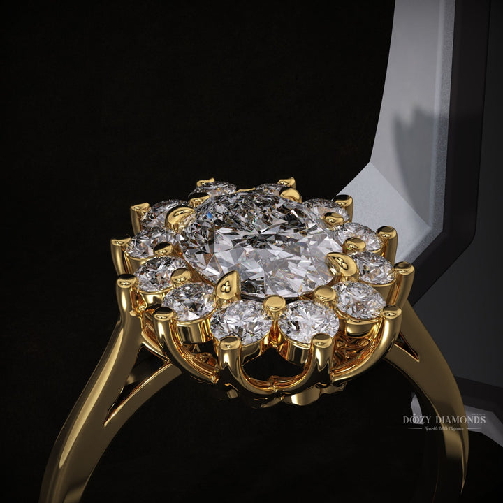 Macro shot of oval cut diamond facets in halo ring setting