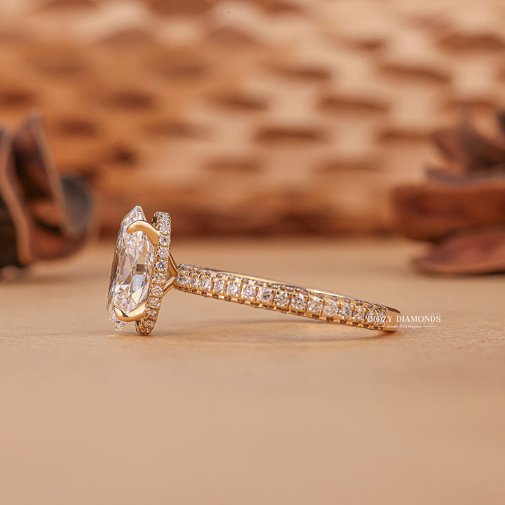 Oval hidden halo ring set with an IGI graded diamond