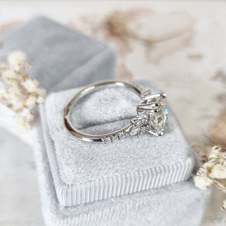Cushion cluster engagement ring viewed from the side