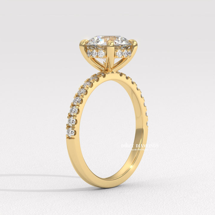 Round hidden halo engagement ring photographed in natural light