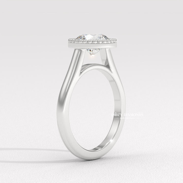 Round bezel engagement ring viewed from the side