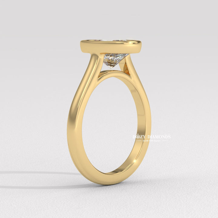 Oval bezel engagement ring close-up highlighting diamond sparkle