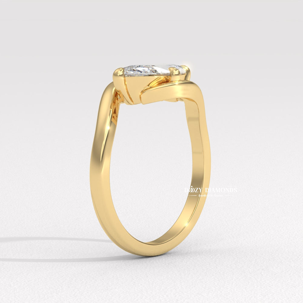 Marquise east west diamond ring displayed on jewelry stand