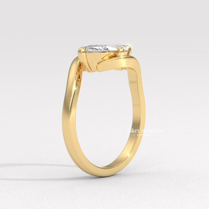 Marquise east west diamond ring displayed on jewelry stand