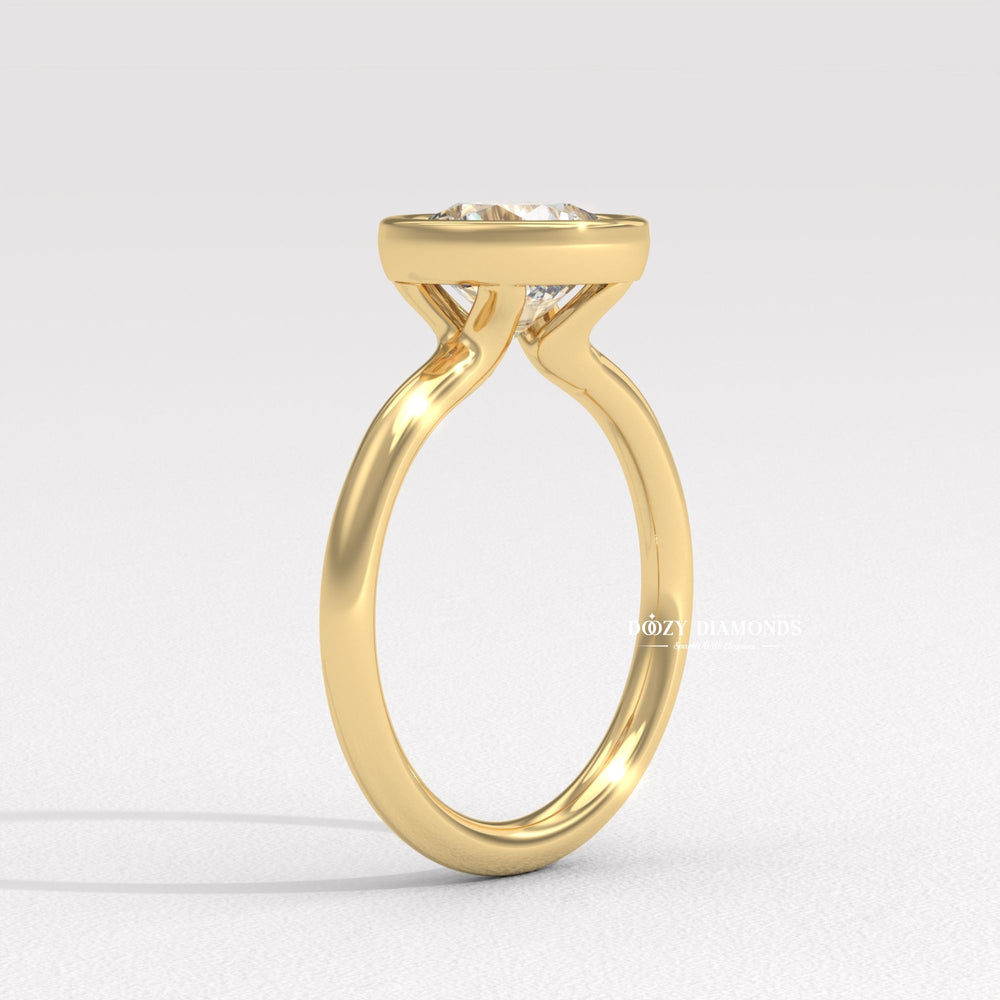 IGI certified round cut diamond in bezel engagement ring setting