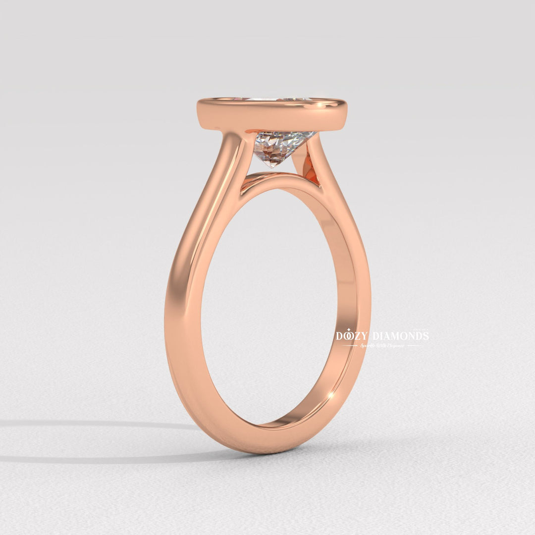 Oval bezel engagement ring viewed from the side