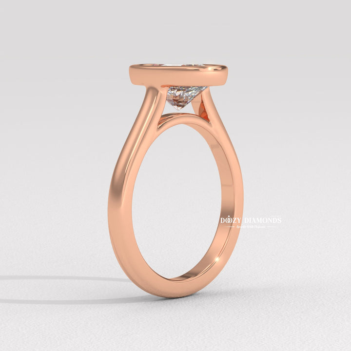 Oval bezel engagement ring viewed from the side
