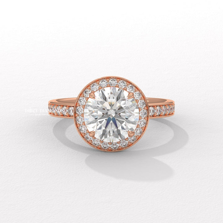 Macro shot of round cut diamond facets in halo ring setting